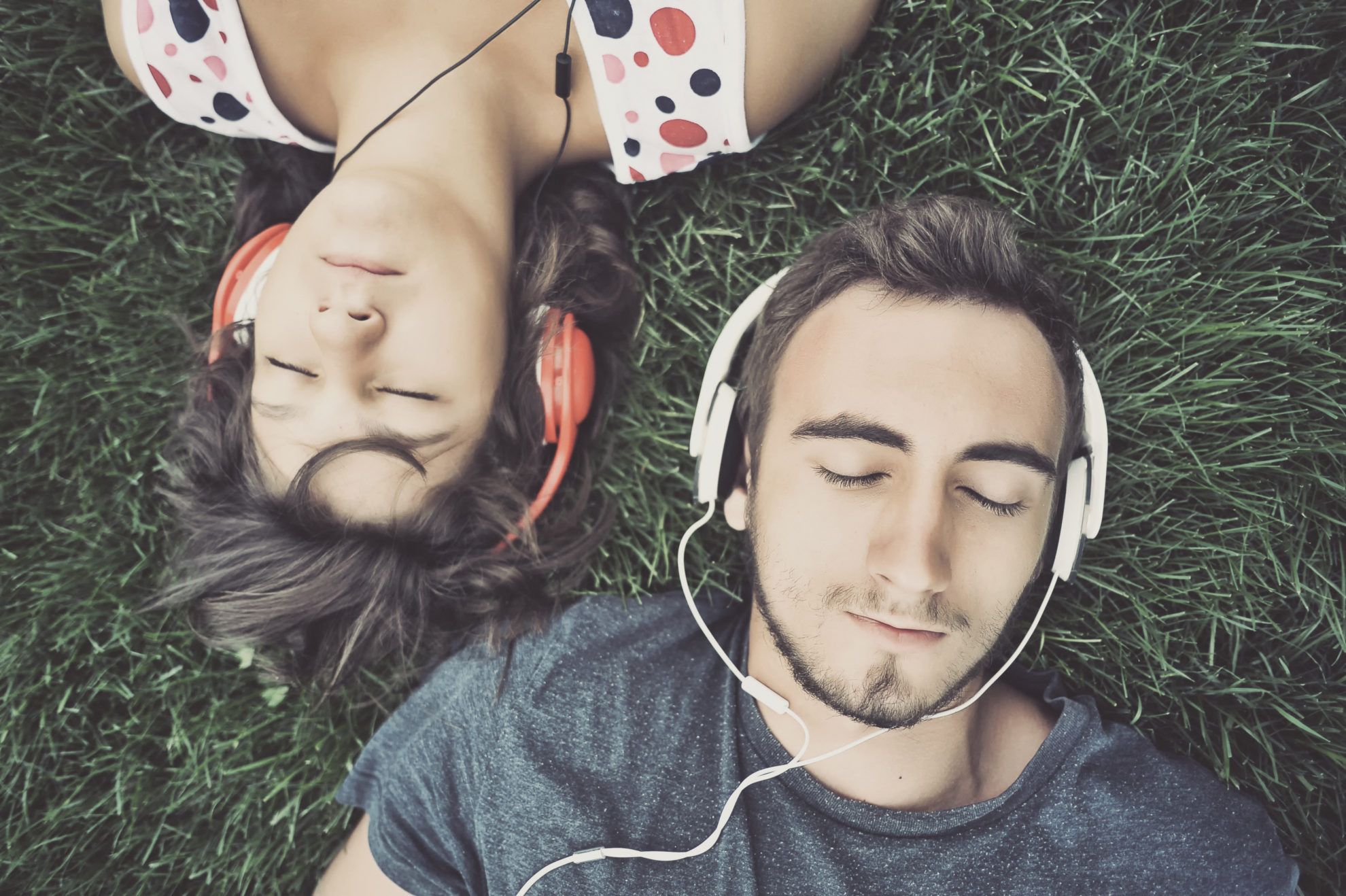 Couple listening to music on headphones