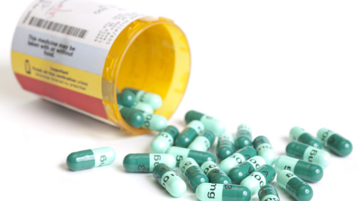 Antibiotic prescription container open.