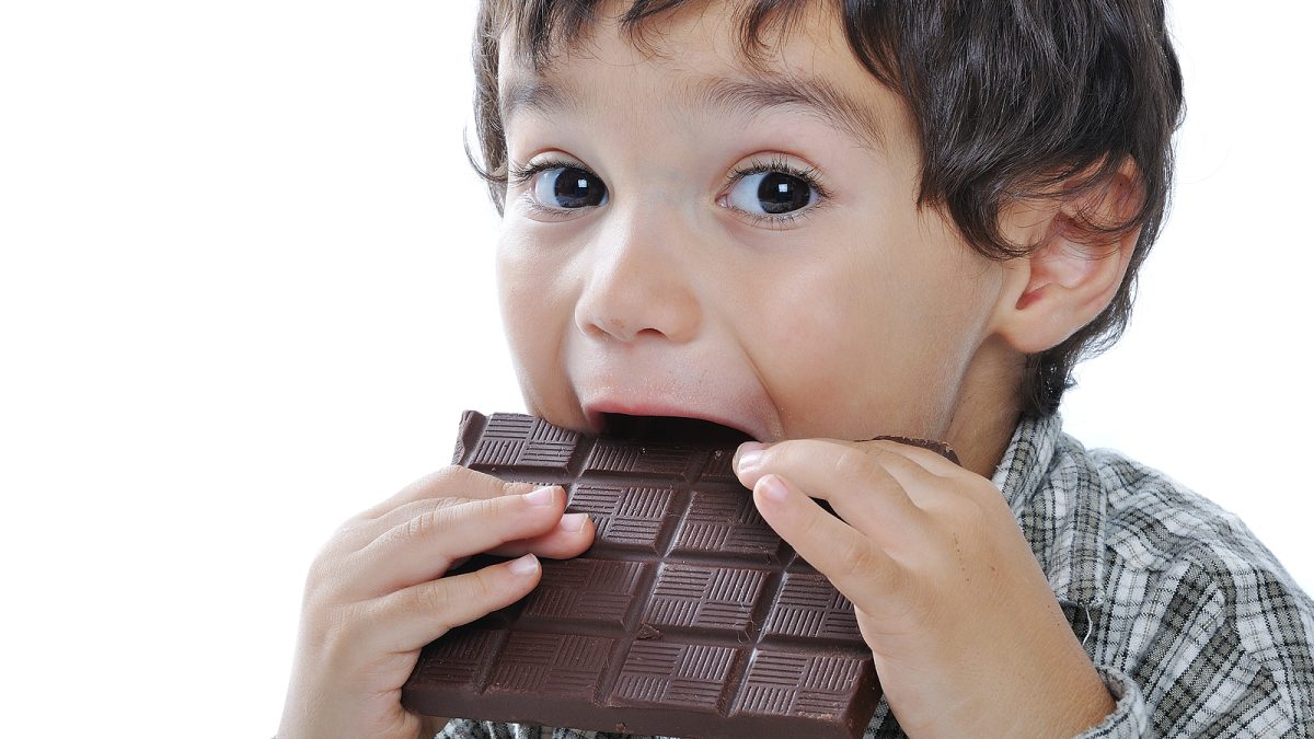 bigstock-very-cute-kid-with-chocolate-15442124