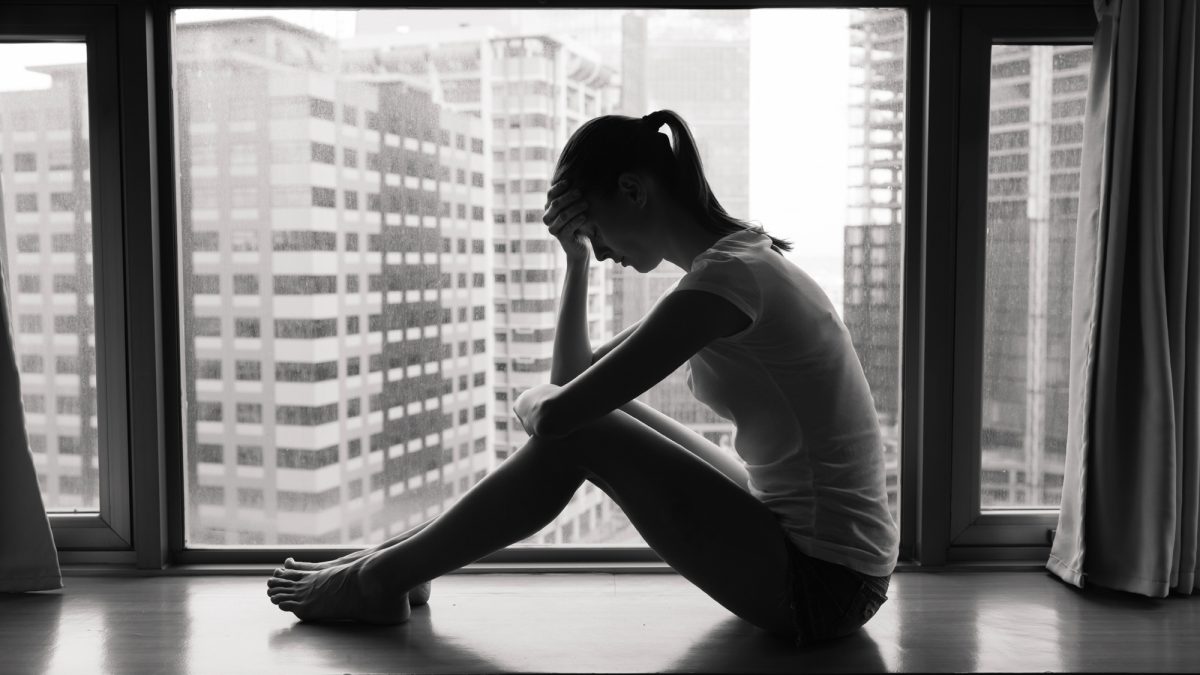 depressed-girl-on-window