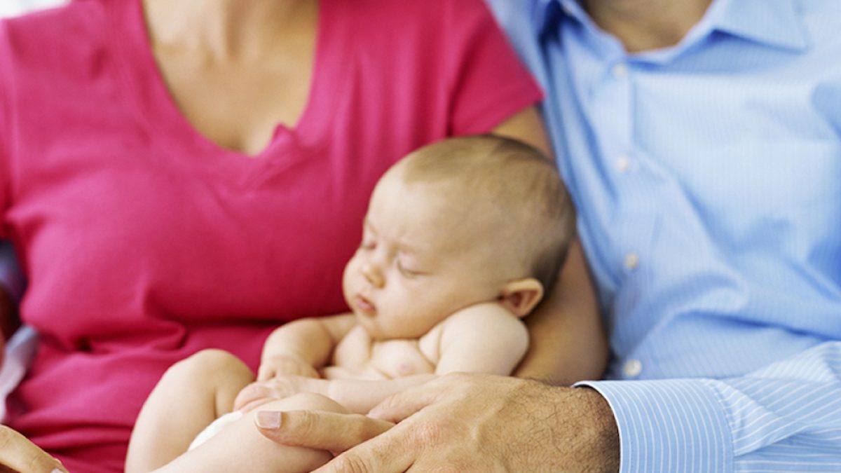 mid section view of a mid adult couple with their son