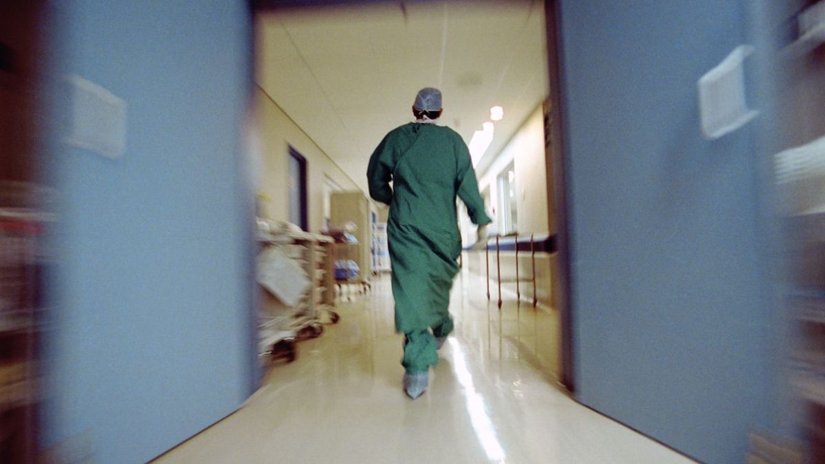 Doctor rushing in hallway