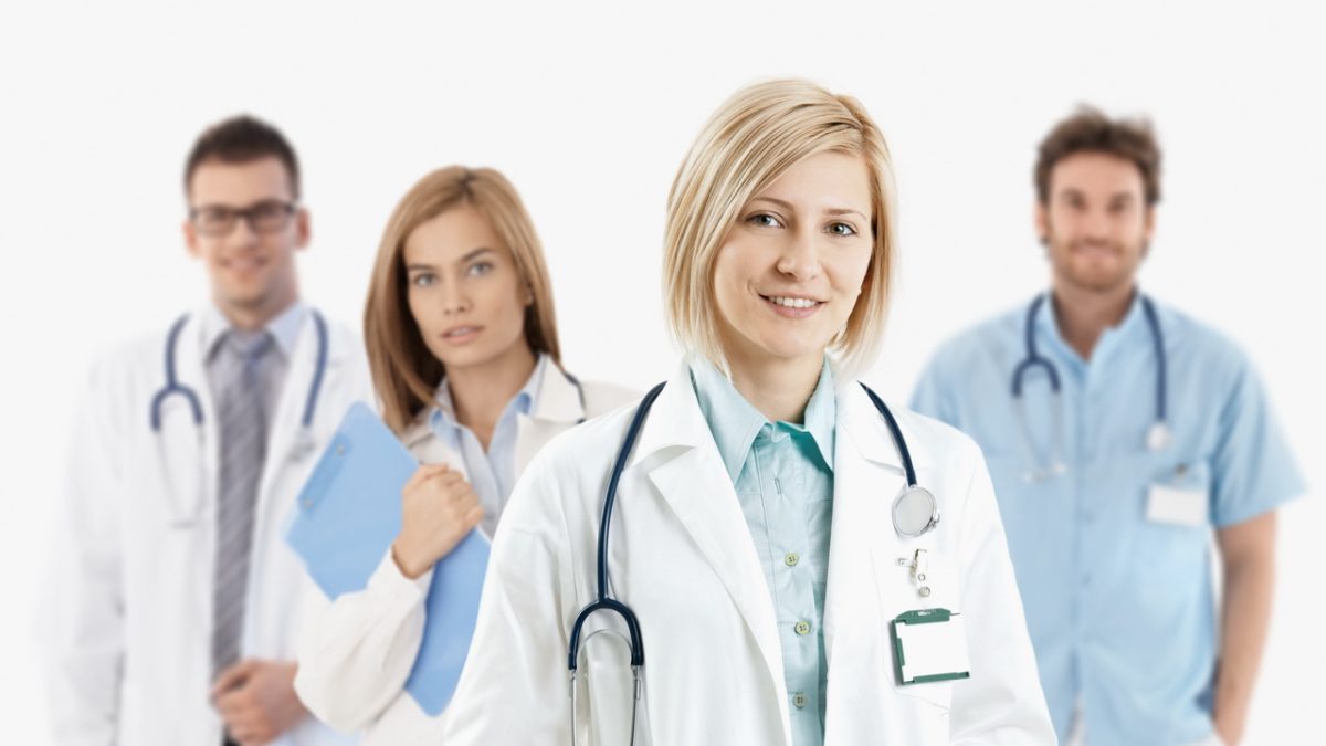 Young medical doctors smiling at camera