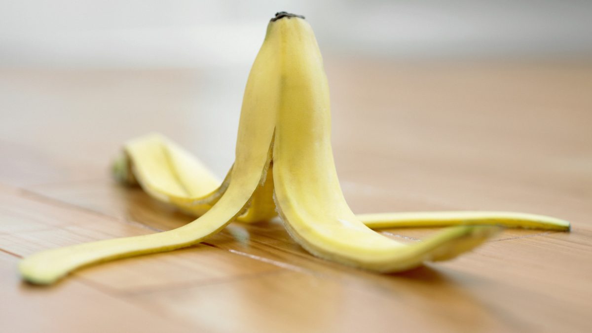 Banana peel on wooden floor