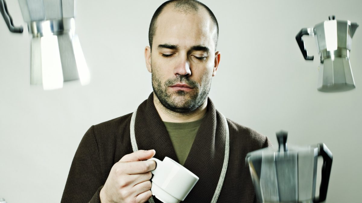 Sleepy Man in Rain of Coffee Machines