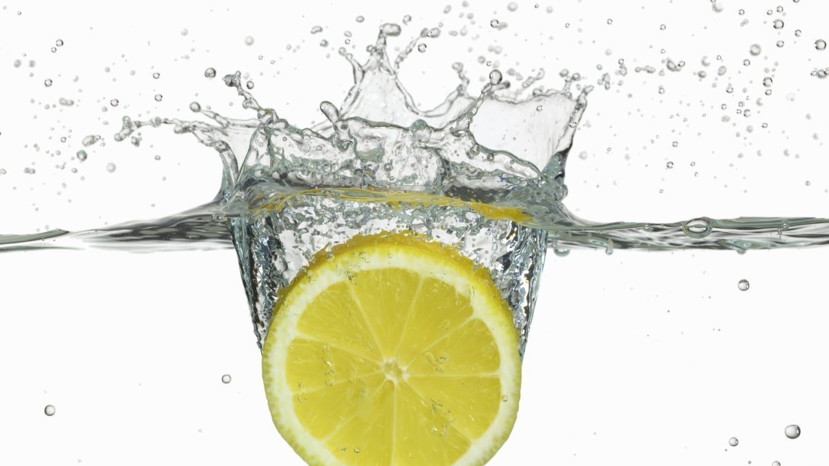 Lemon splashing in water